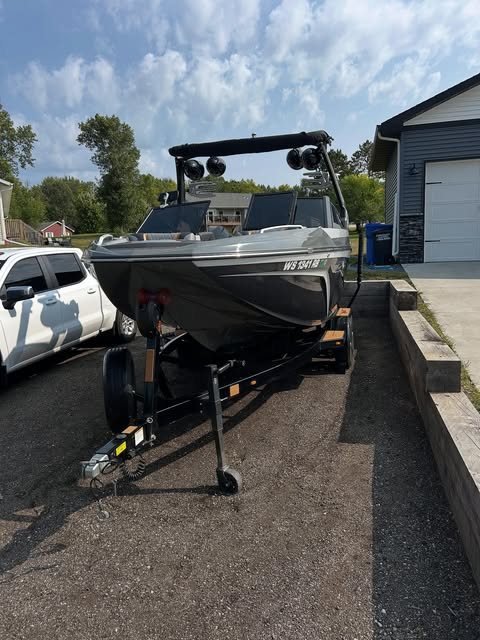 A wake boat on its trailer after a detail